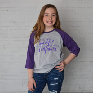 Grey with purple sleeves "The most beautiful thing a girl can wear is confidence" youth t-shirt