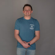 Teal shirt with white Self Love Beauty logo
